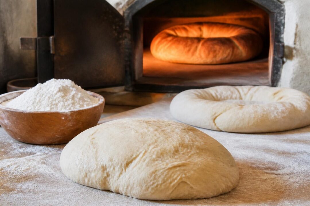 scopri la ricetta originale della pitta calabrese con impasto tradizionale, forma a ciambella e consigli per la cottura perfetta.